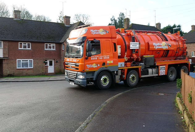 Sewage waste collection tanker at commercial site